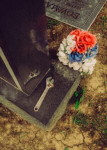 Flowers laid at a family grave after an ashes interment